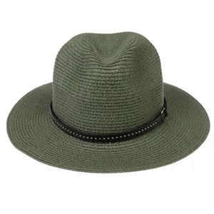 Detailed texture of moss green straw fedora hat with studded leather band decoration