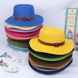 Detailed stack of multi-color woven straw sun hats with elegant leather buckle bands