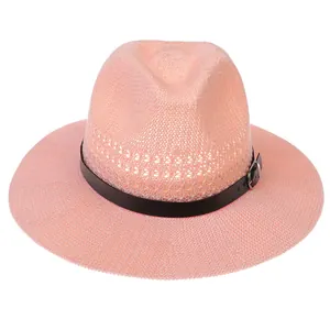 Detail view of pink hollow woven fedora with black leather band and silver buckle