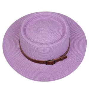 Detailed macro view of purple woven boater hat with a leather strap and metal buckle