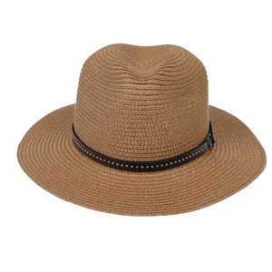 Detailed view of khaki Panama hat with woven texture and silver rivet studded leather band