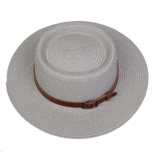 Close-up of grey woven boater hat featuring a brown faux leather belt with black buckle