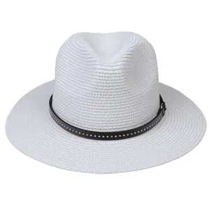 Close-up of white Panama hat with woven texture and studded leather band detail