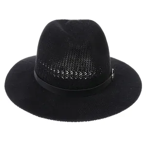 Close-up of black woven fedora hat with fine texture and black band with metal buckle