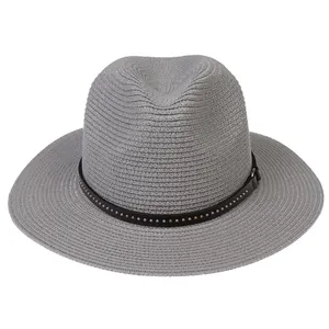 Close-up of grey woven Panama hat with black leather band and metallic studs
