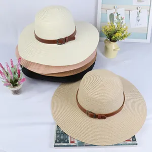 Detail of wide brim straw hats in multiple colors featuring vintage buckle leather bands