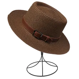 Detail of dark brown woven fedora with leather band and metal buckle on display stand