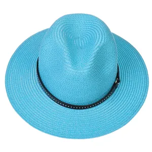 Detail of light blue straw fedora featuring a black band with silver metal rivets