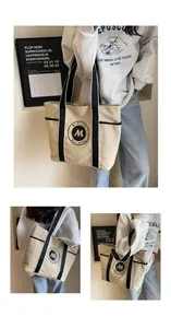 Detalle del bolso tote de lona beige con asas negras y logotipo M bordado