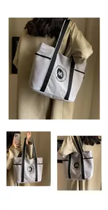 Tres vistas de un bolso tote grande de lona gris con asas negras y detalle de logo