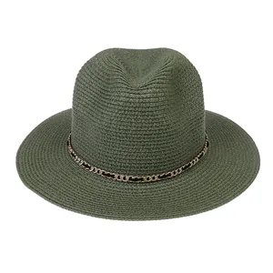 Close-up of green fedora hat with metal chain detail and classic straw weave texture