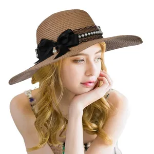 Elegant wide brim straw sun hat with black ribbon bow and pearl trim for women summer beach
