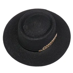 Detailed top view of black boater hat featuring elegant golden metal leaf chain decoration