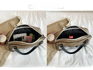 Detail view of the brown ita bag interior showing a large capacity compartment with zipper