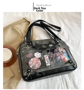 Detail view of Dark Tea Color leather Itabag with transparent windows and star studs