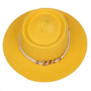 Detailed top view of a yellow straw hat with rhinestone chain and white rope trim