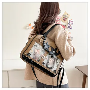 Brown and black itabag shown from side-back view on a model in a cozy indoor setting