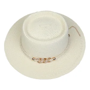Detail of cream boater hat featuring braided rope and gold chain with rhinestone accents