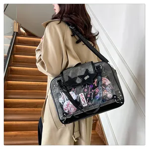 Detailed view of grey canvas ita bag with star decor and clear window for anime pins