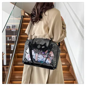 Detail of ITA bag showing transparent PVC star windows with anime cards and silver hardware