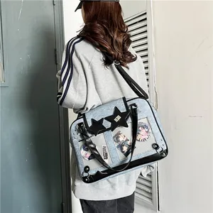 Light blue Itabag with clear display windows and black star accents for anime badges