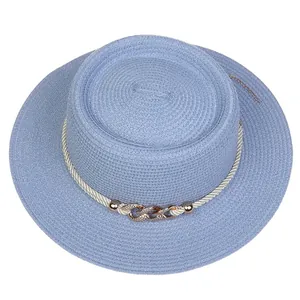 Detail of light blue boater hat with white rope trim and rose gold rhinestone chain