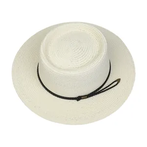 Top view of cream boater hat with fine straw weave and black cord detailing