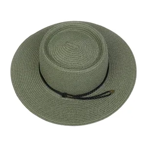Top view of green woven straw boater hat with black rope and metal arrow accents