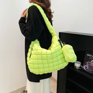 Neon green quilted cloud tote bag with matching coin purse shown on female model