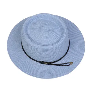 Detailed close-up of light blue boater hat weave with black rope and metal tips