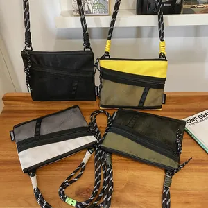 Waterproof nylon crossbody bags in multiple colors with grid mesh and paracord straps