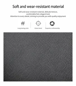 Close-up detail of grey pebble grain leather fabric showing durable texture for handbags