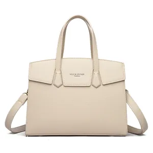 Sac à main en cuir beige avec fermoir doré et bandoulière amovible en toile de qualité