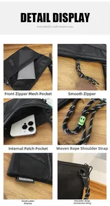 Detail view of multi-compartment nylon bag with mesh pocket and braided strap