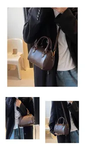 Close-up of dark brown vintage Boston bag with gold metal hardware and pebbled leather texture