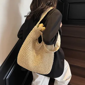 Fashionable beige straw tote bag with woven texture and large capacity for beach vacations