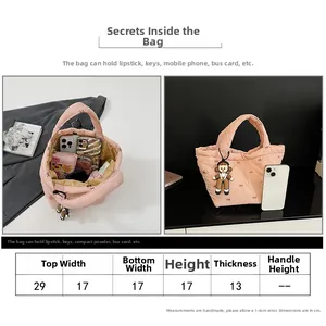 Size chart showing 29cm width pink quilted puffer bucket bag with bow embroidery details
