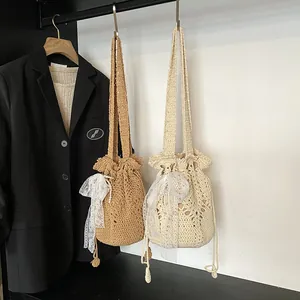 Chic hollow woven bucket bag in khaki and beige with lace bow and drawstring