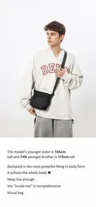 Detailed view of casual black nylon crossbody bag on a 175cm tall model in studio