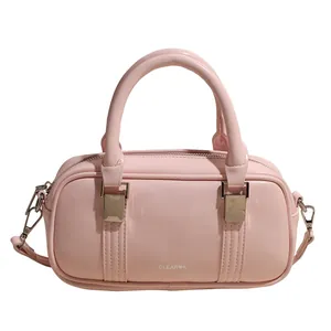 Light pink Boston handbag in glossy PU leather with double handles and metal hardware