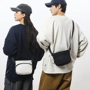 Versatile nylon crossbody bag with adjustable strap and dual zipper compartments for daily use
