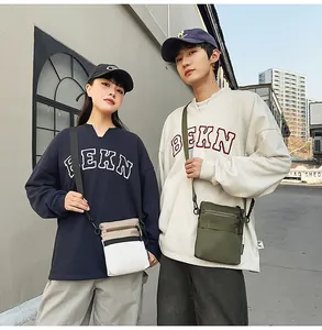 Street style view of durable nylon crossbody bags in white and olive green colors
