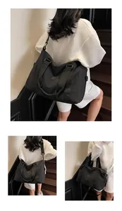 Close-up of durable black travel bag showing adjustable shoulder strap and side buckles