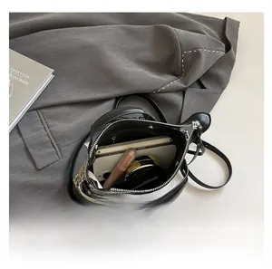 Top view of snake print handbag interior showing space for phone and makeup