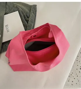 Macro view of bright pink canvas tote bag interior with wave pattern and zipper layer