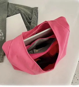 Interior view of large pink canvas tote bag showing spacious compartments and zipper