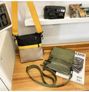 Close-up of nylon crossbody bags with multi-pocket zippers and adjustable wide straps
