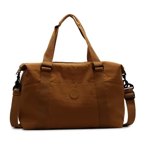 Brown large capacity travel duffel bag with crossbody strap and fashion logo