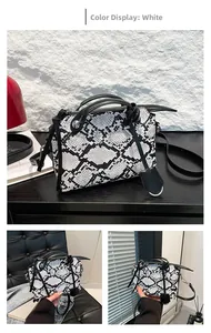 Detailed view of the black and white snakeskin texture on a faux leather Boston bag