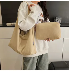 Minimalist beige canvas hobo tote bag set with a matching small zipper pouch
